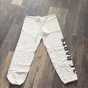 Cream Joggers with Black Side Lettering saying st  barts